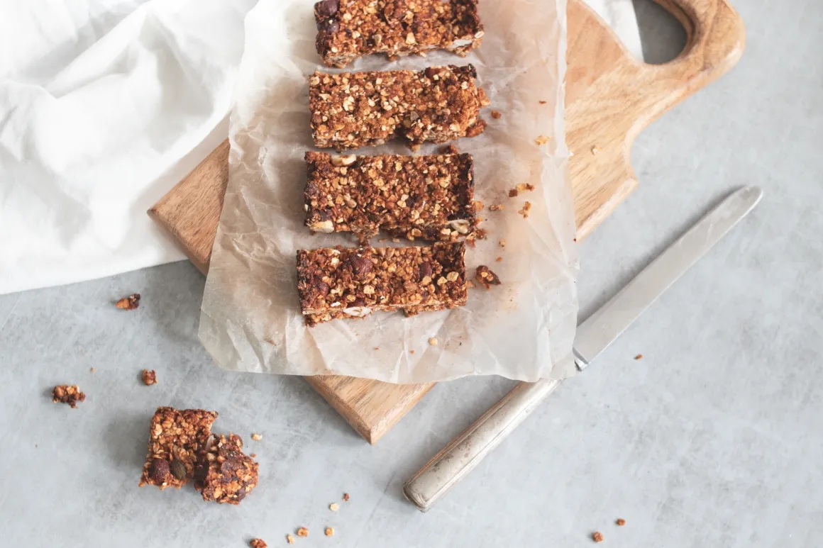 Homemade granola bars on wooden board