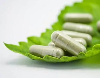 Multiple capsules on green leaf