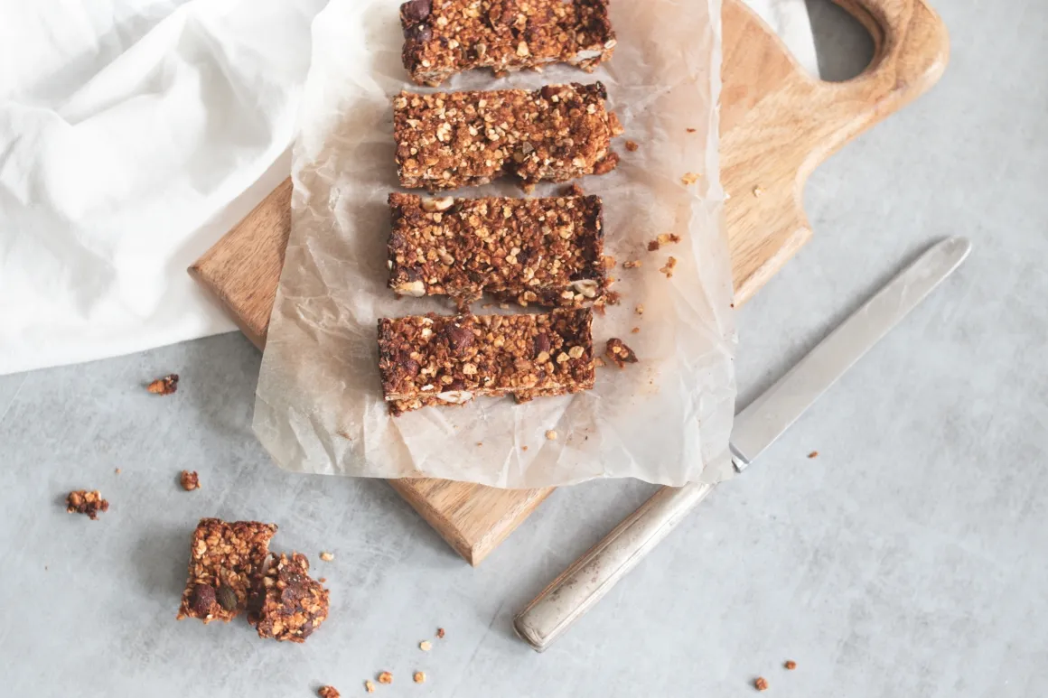 Homemade granola bars on a wooden board