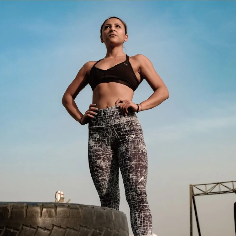 Young athletic woman in sports clothes looking ready for workout