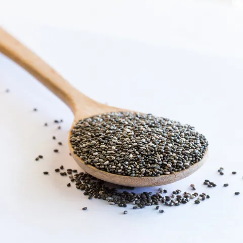 Wooden spoon filled with chia seeds