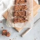 Homemade granola bar on wooden board
