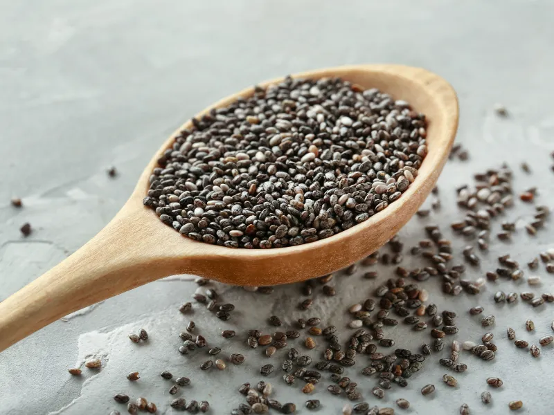Wooden spoon filled with chia seeds
