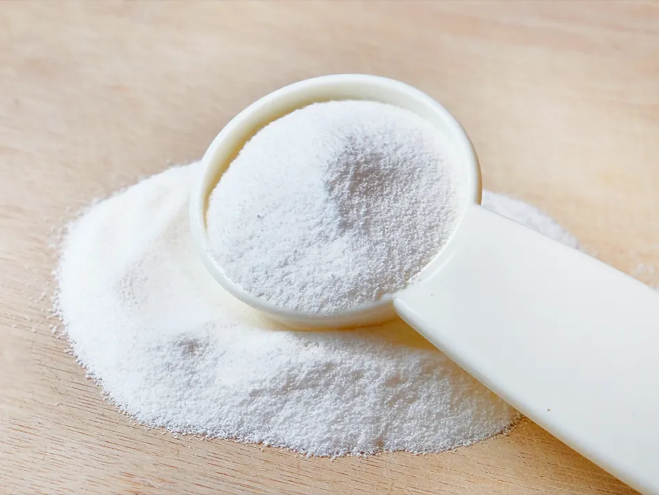 A spoon with powdered kombucha