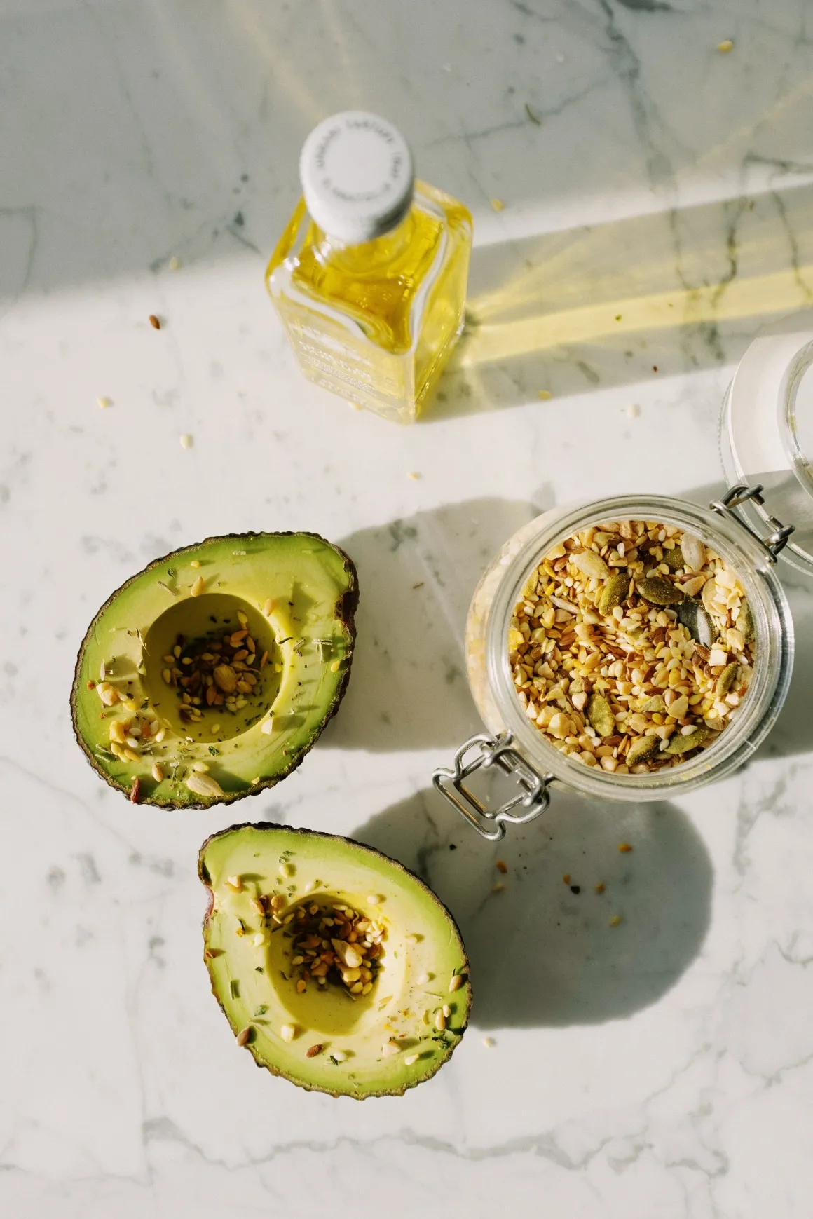 Sliced avocado prepared for eating with some grains