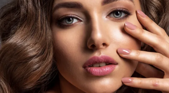 Portrait of a woman with fair skin and voluminous hair