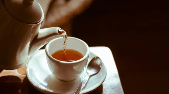 Roiboos tea being poured into a teacup