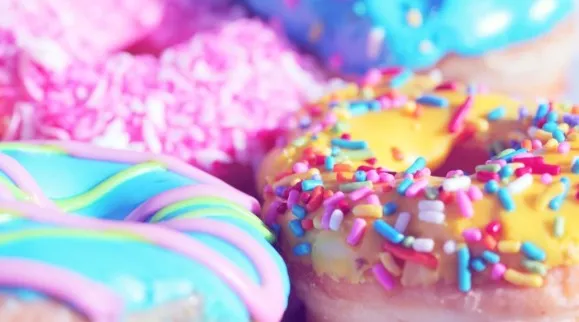 Donuts with colorful icing and sprinkles