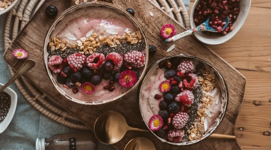Flatlay of a breakfast bowl with cereal and fresh fruit