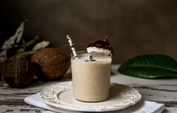 Milky beverage with coconut decorations