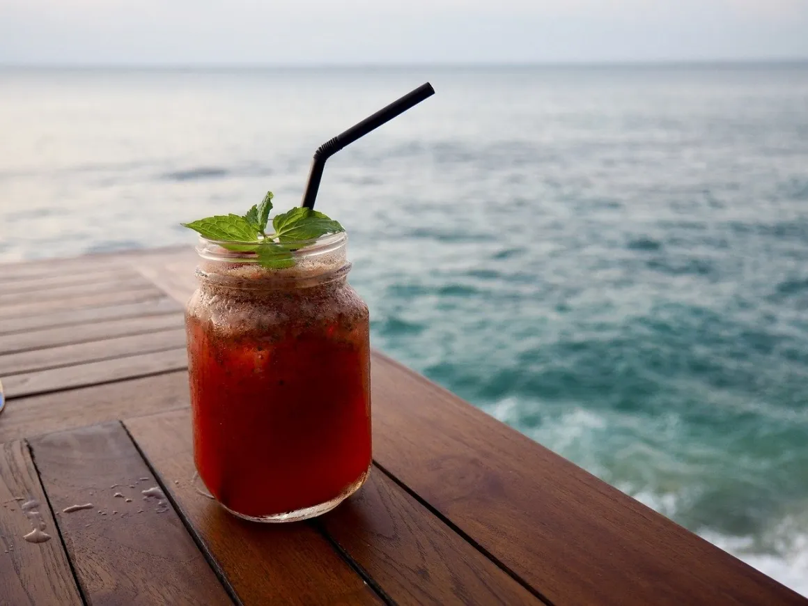 Iced kombucha in a jar at the seaside