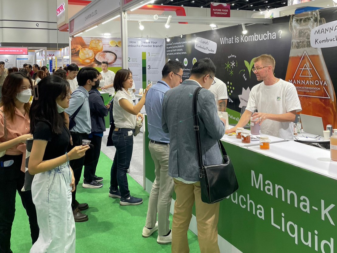 many clients standing in front of the booth