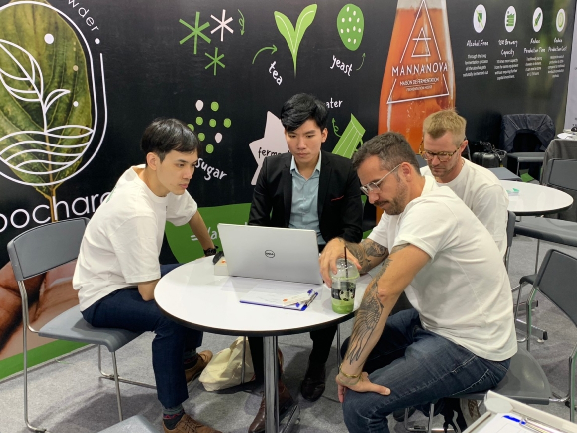 client and champion employees sitting around the table